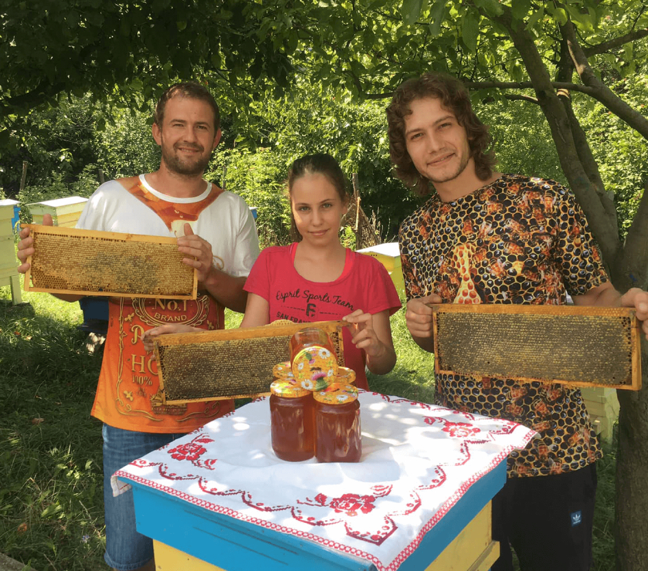 beekeepers asen and george with their products and young lady